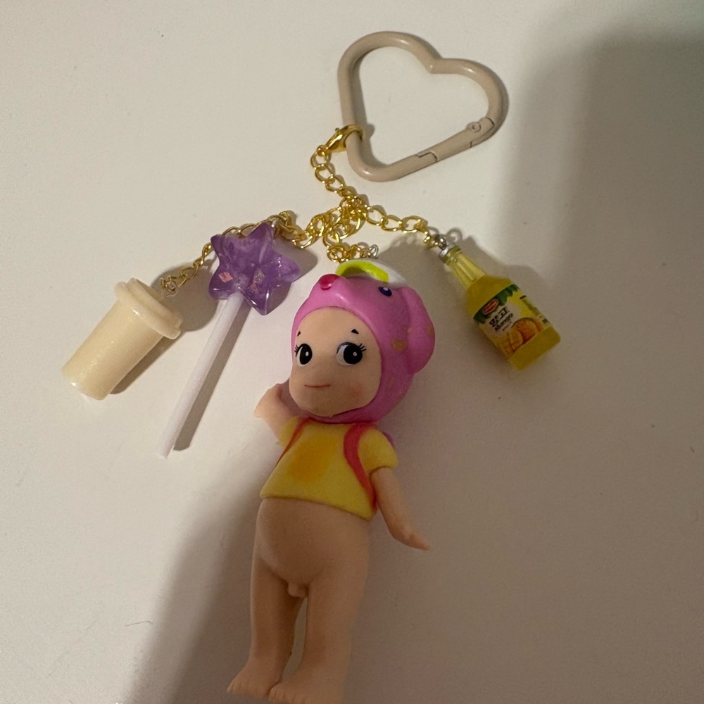 Cute Character Keychain with Pink and Yellow Accents